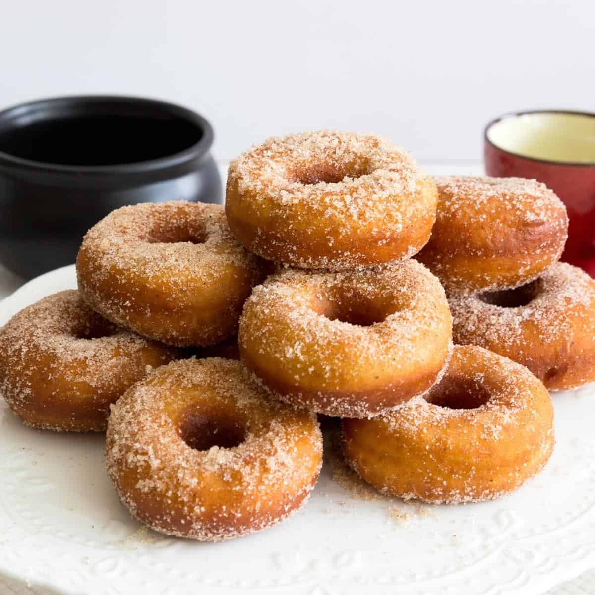 A stack of pumpkin donuts.