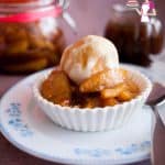 A bowl of ice cream with caramel apples.