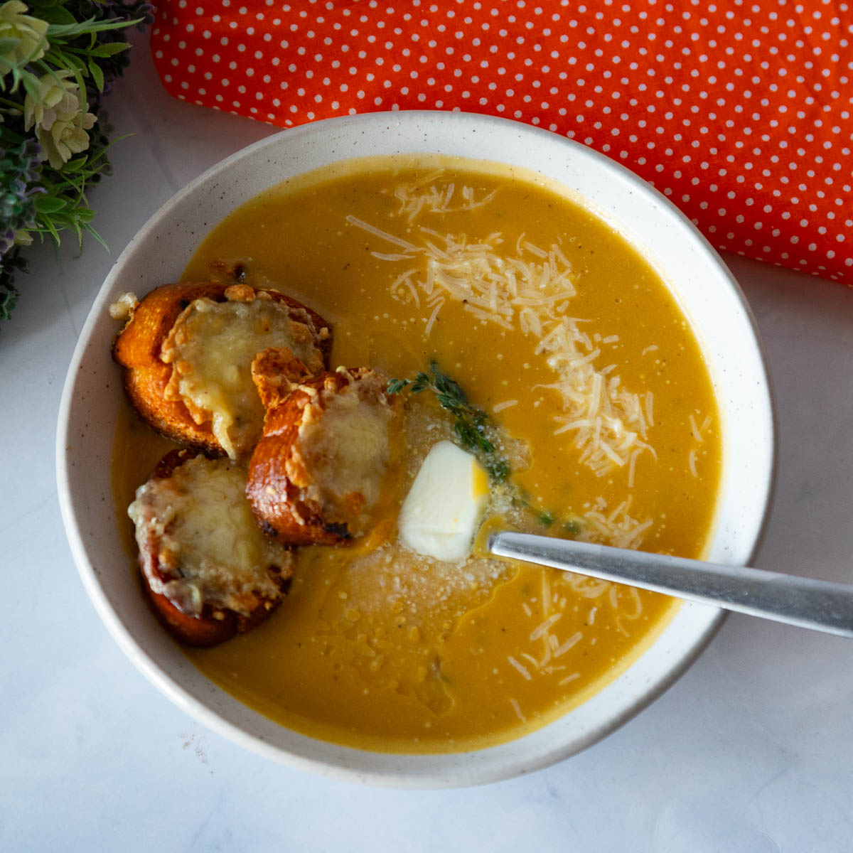 Soup and toast in a bowl.