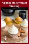 Cupcakes with eggnog buttercream frosting on a round board.