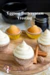 Cupcakes with buttercream frosting on a round board.