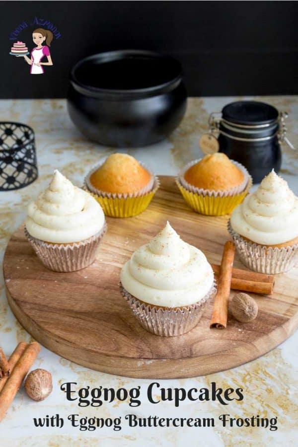 Cupcakes with eggnog buttercream frosting on a round board.