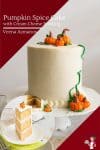 A pumpkin cake with buttercream frosting and pumpkin cake toppers.