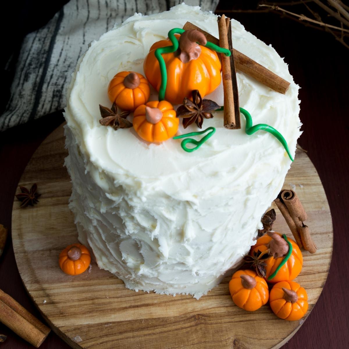 A frosted spice latte cake with fondant pumpkins.