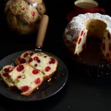 Slices of cherry cake on a black plate.