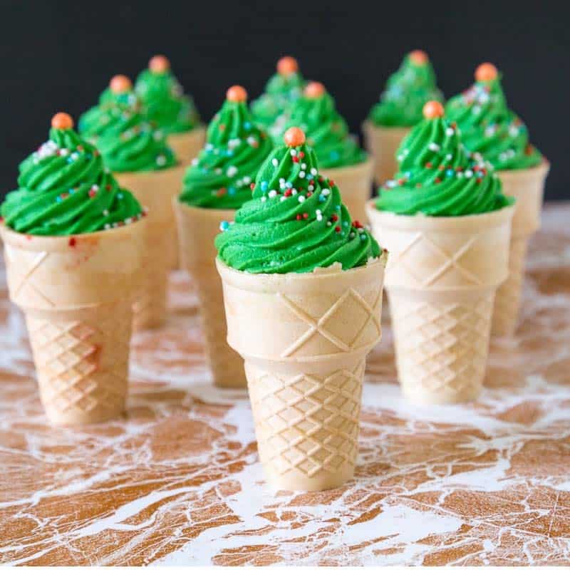 Cupcakes in ice cream cones with green frosting.