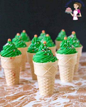 Cupcakes in ice cream cones with green frosting.