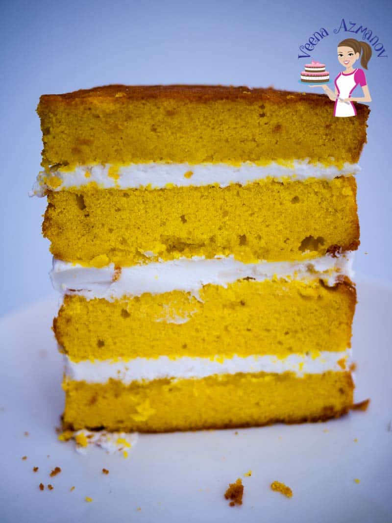 A slice of lemon cake decorated with lemon buttercream.