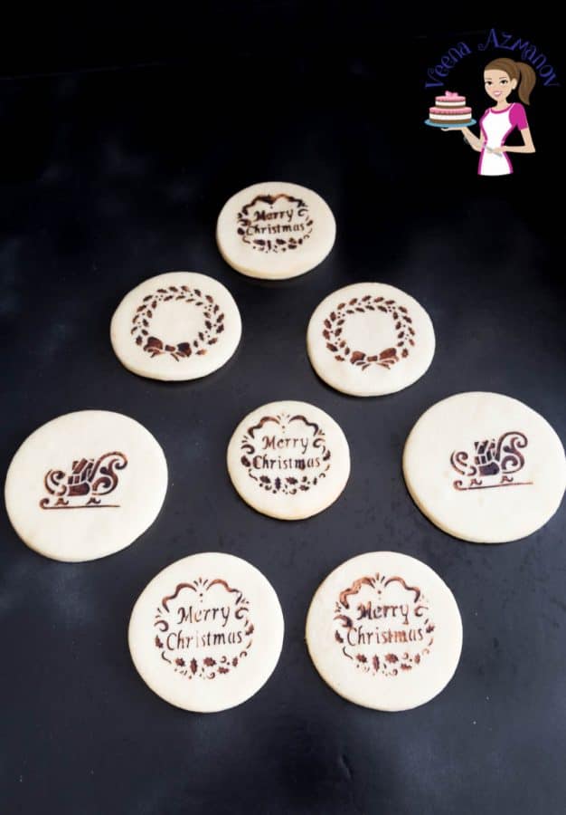Stenciled sugar cookies on a table.