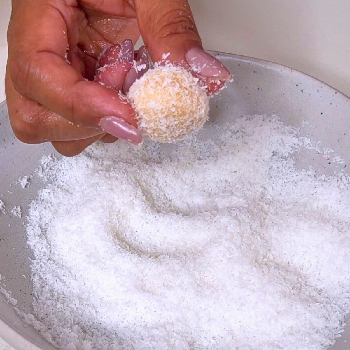 Desiccated coconut and white chocolate balls.