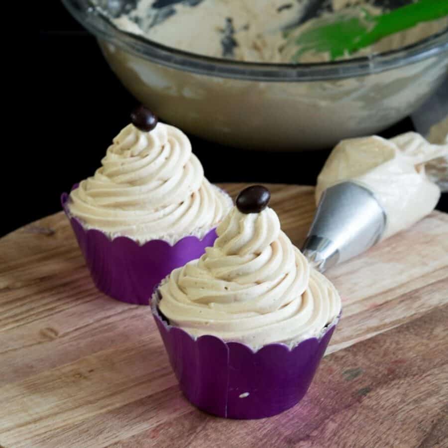 Two frosted cupcakes with coffee buttercream