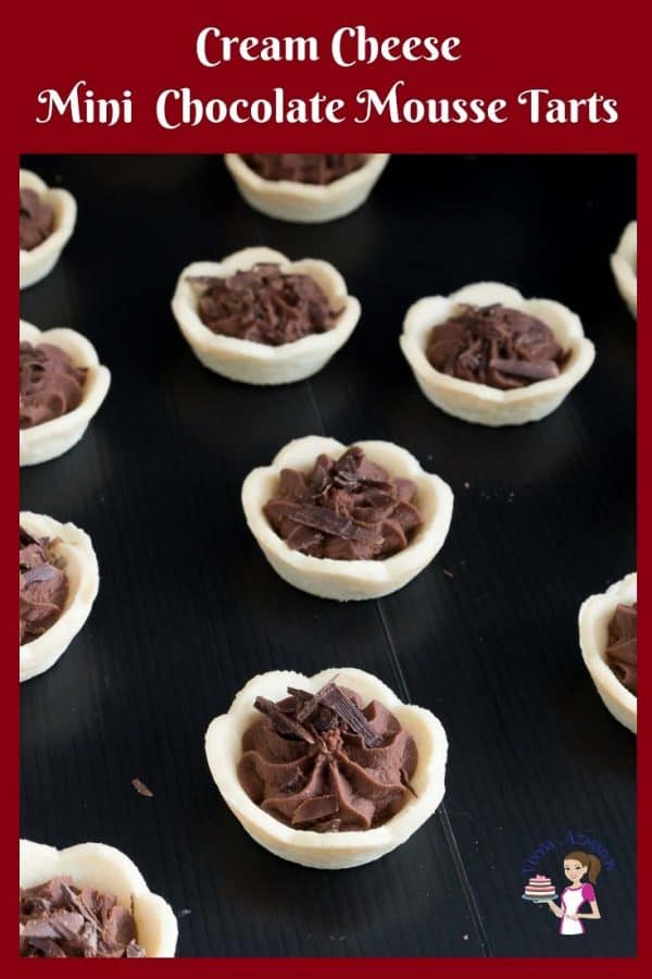Mini chocolate mousse tarts on a table.