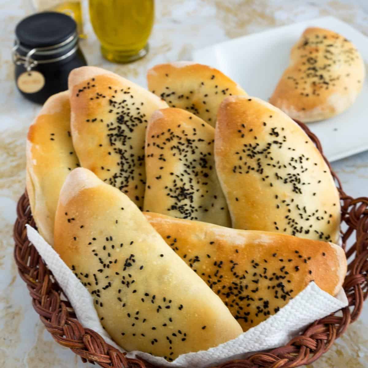A basket with stuffed pita breads.