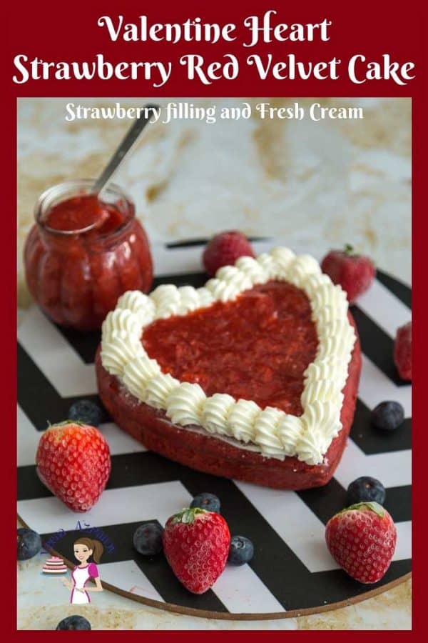 A red heart-shaped cake on a round board.