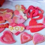 Assorted heart cookies marbled in pink.