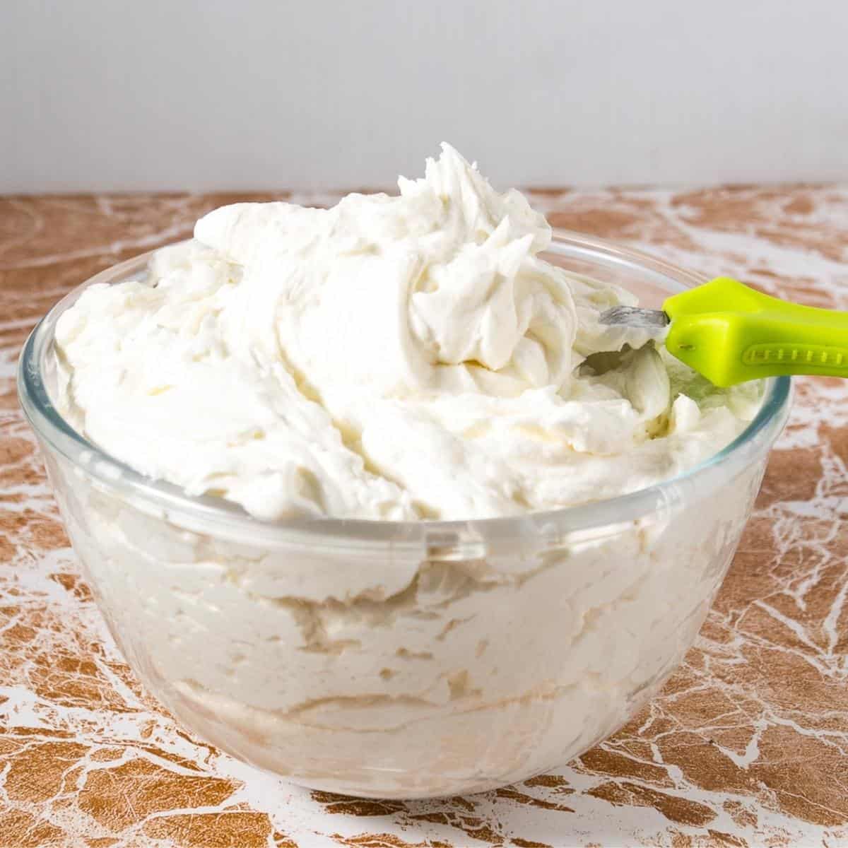 A bowl of vanilla buttercream frosting.
