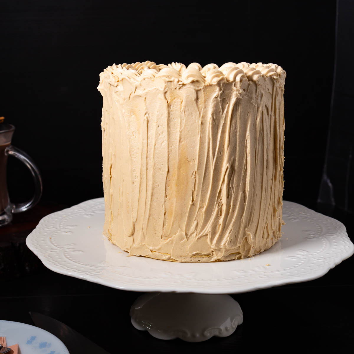 A frosted cake on the table.