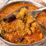 A skillet with chicken curry.