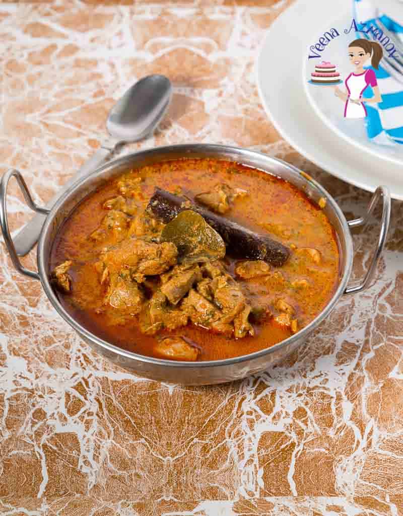 An Indian chicken masala curry served in a Indian bowl.