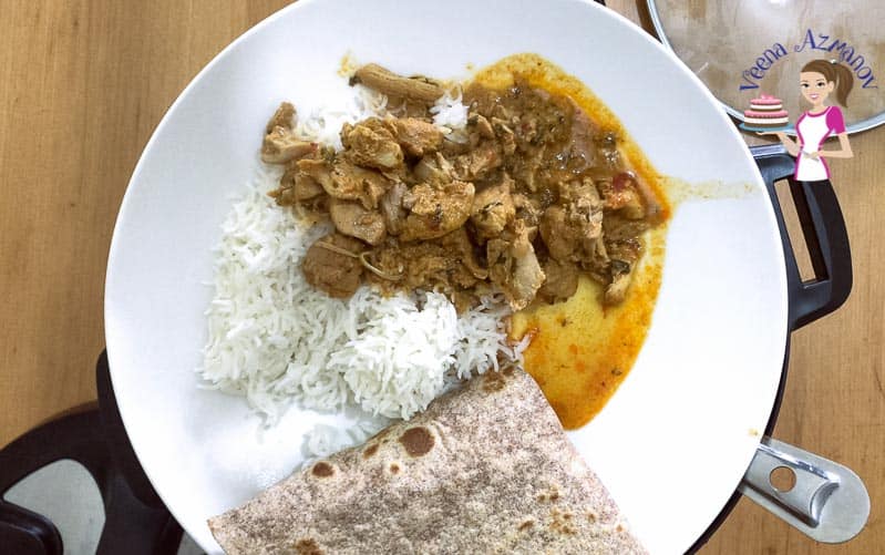Chicken curry served with white steamed rice and whole wheat chapati.