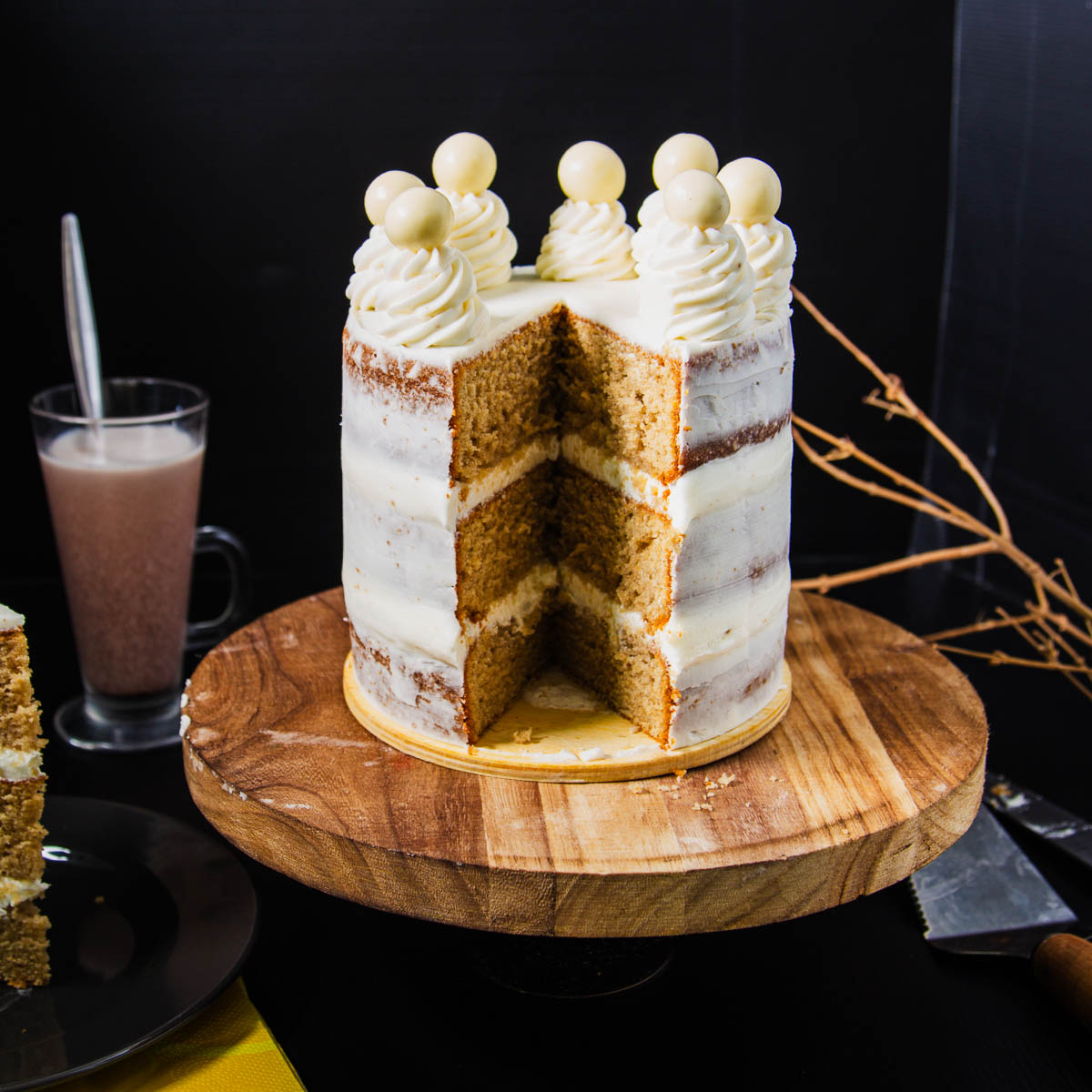 A sliced naked cake on the table.