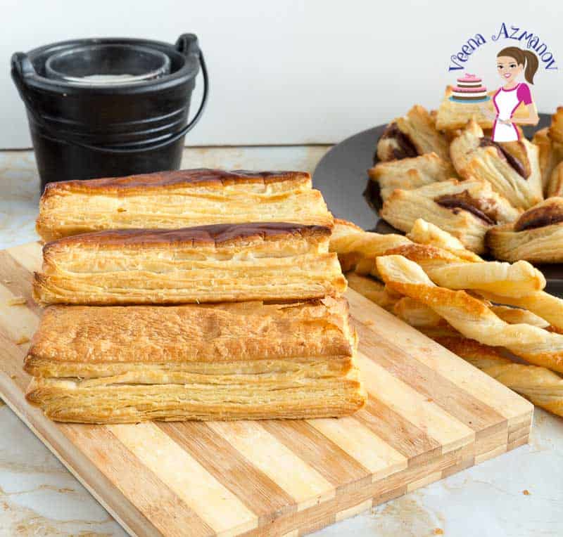 Baked puff pastry on a wooden board.