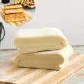 Puff pastry on a wooden board.