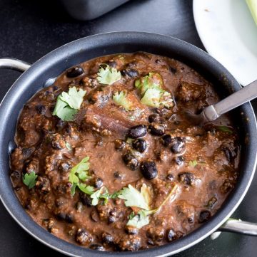 A bowl of black beans curry.