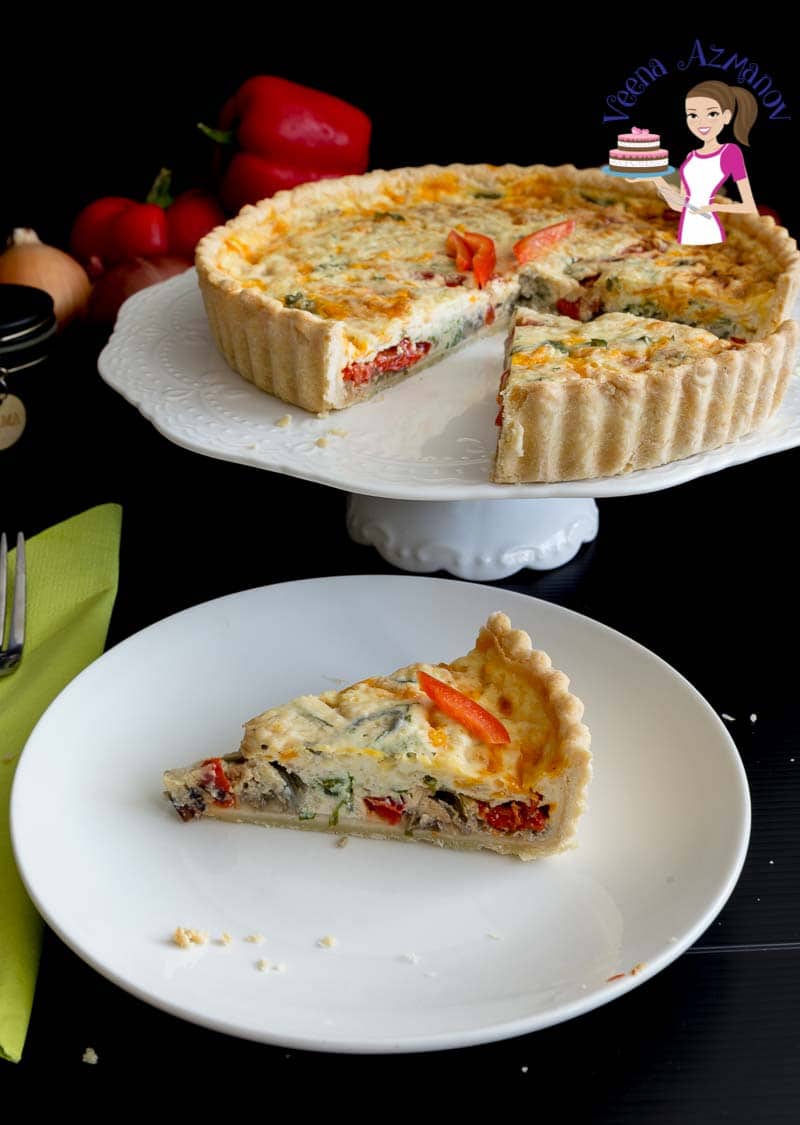 A slice of red peppers quiche on a plate.
