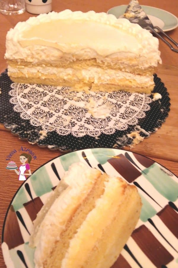 A slice of mascarpone cream cake on a plate.