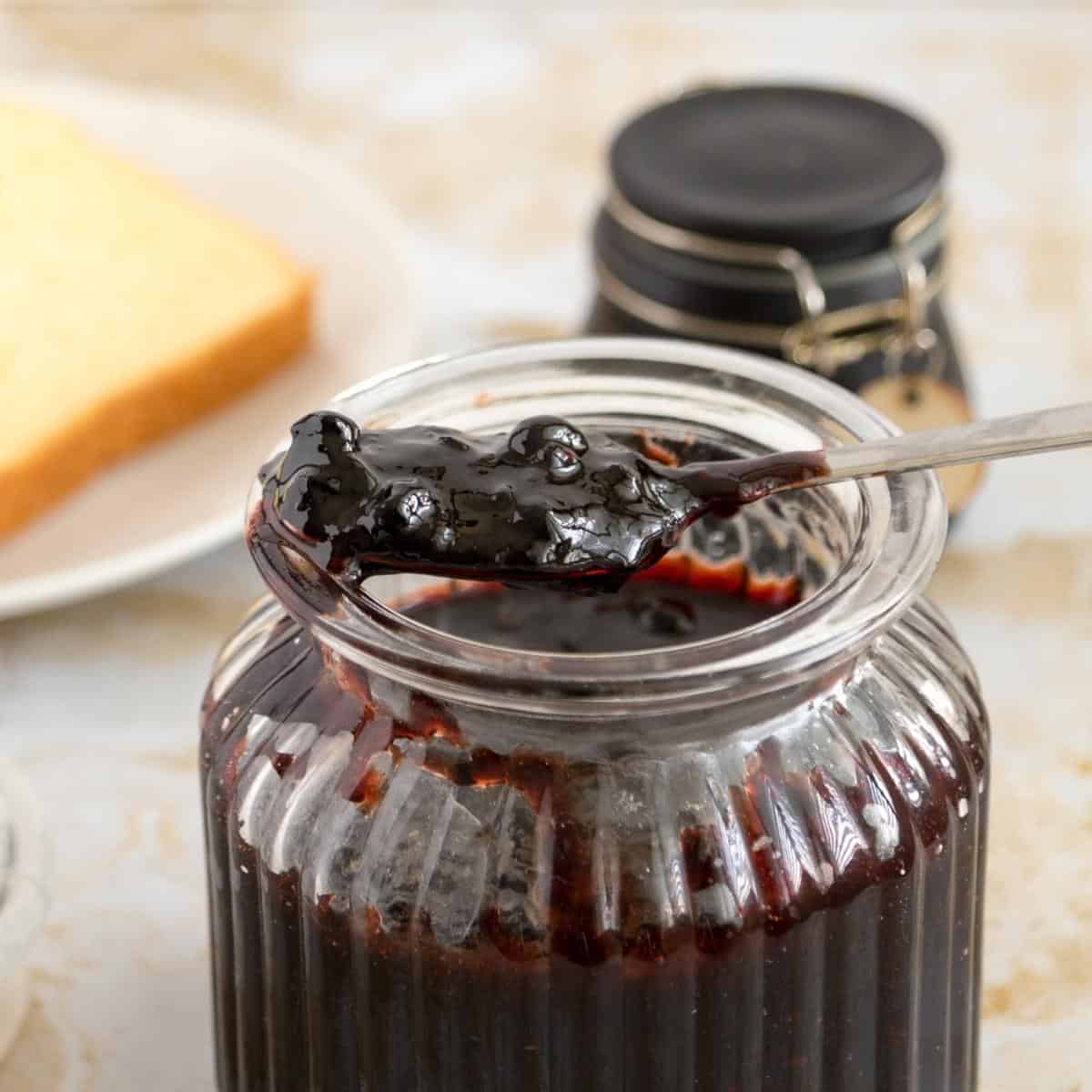 A jar with blueberry jam.