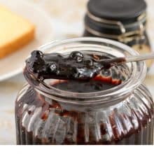 A jar with blueberry jam.