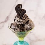 A glass with easy ice cream made with crushed oreos.
