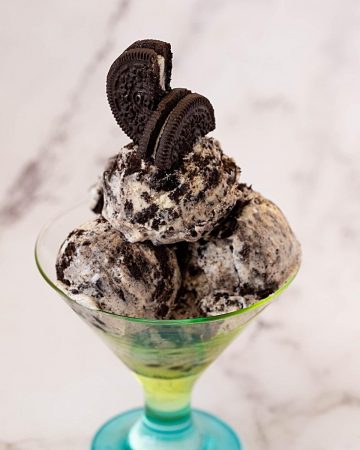 A glass with easy ice cream made with crushed oreos.
