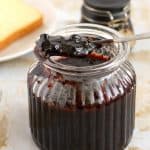 A jar with blueberry jam.