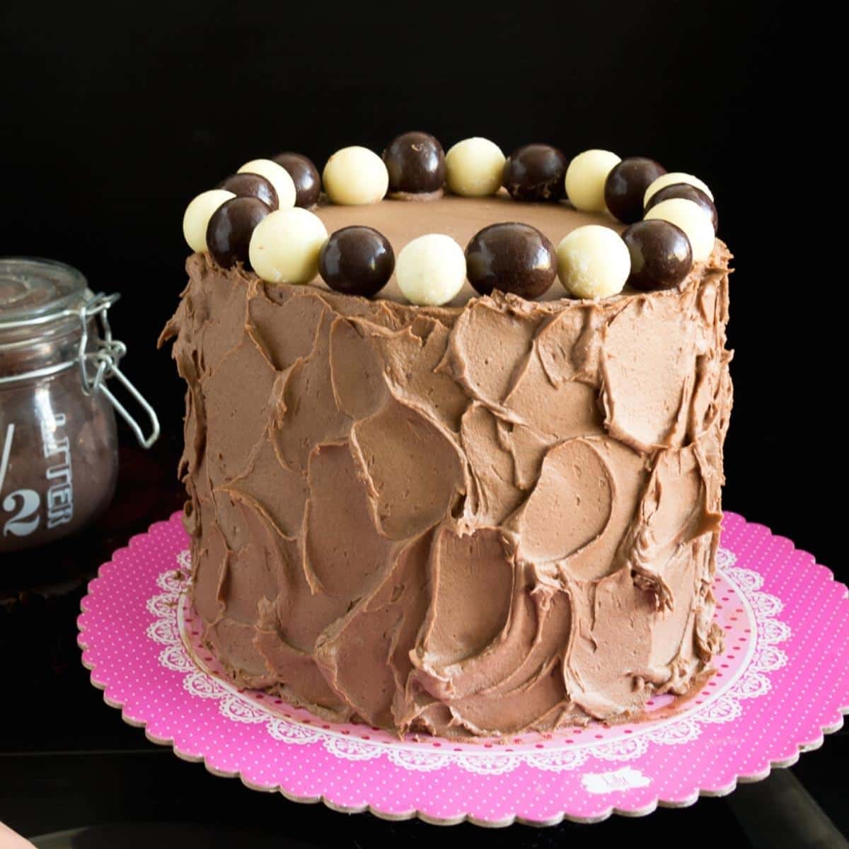 A vanilla cake with chocolate frosting.