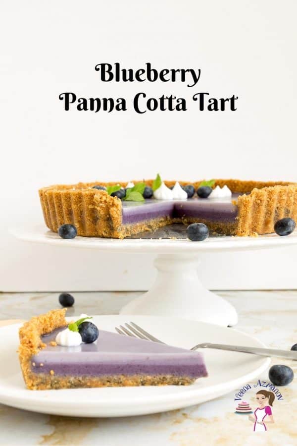 A blueberry panna cotta tart on a cake stand.
