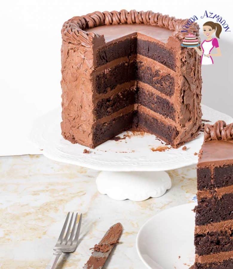 A Chocolate fudge cake on a stand.