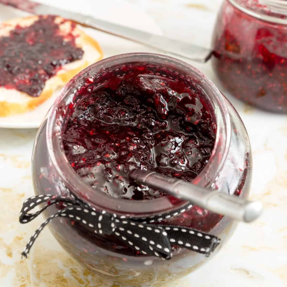 Berry jam in a mason jar.