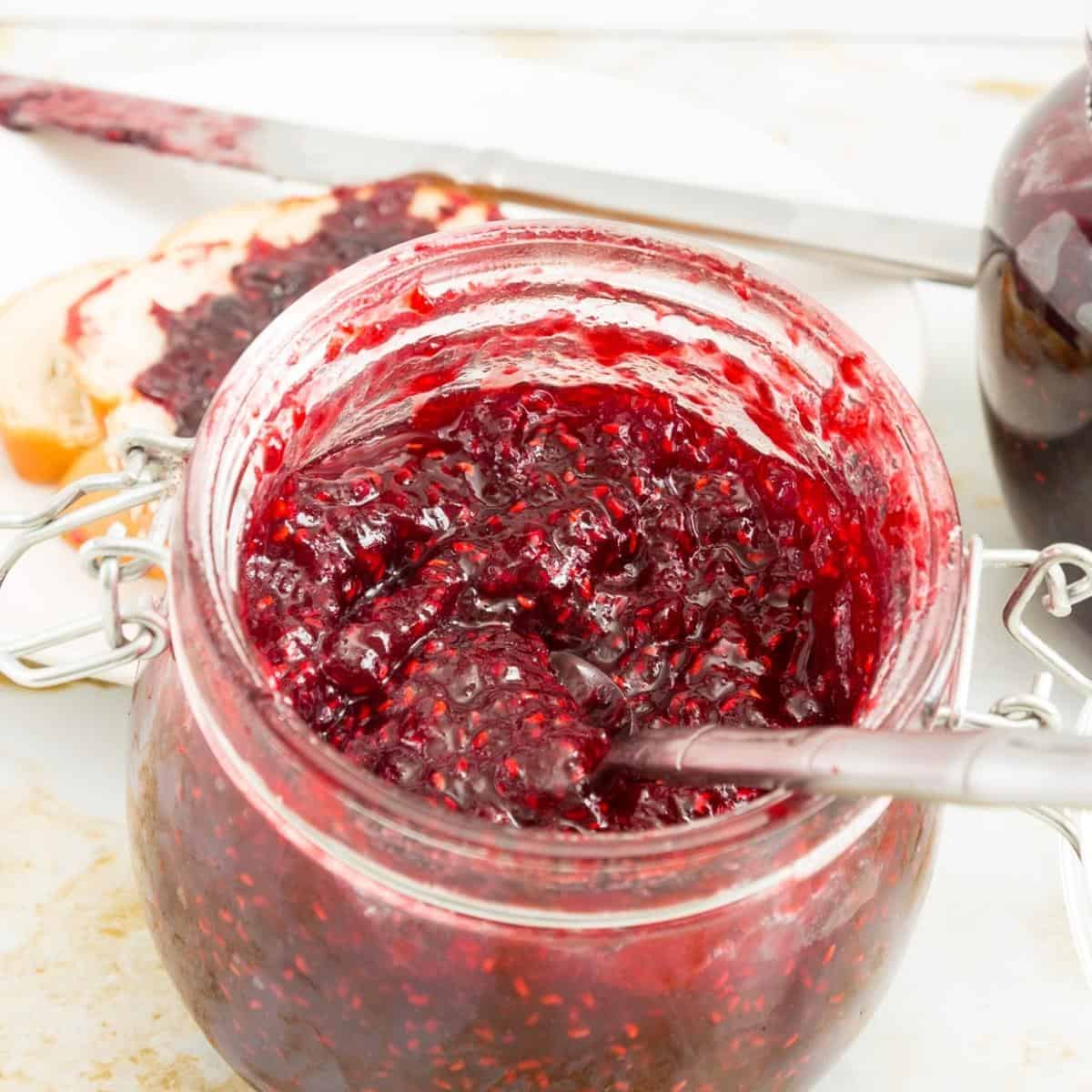 A jar with raspberry low sugar jam.