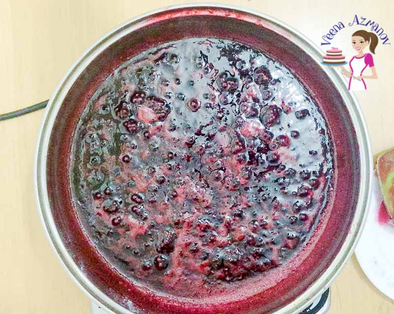 Making Raspberry jam in a sauce pan.