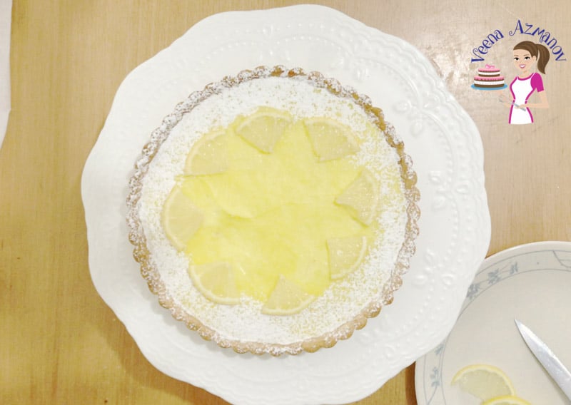 Garnish the lemon tart with lemon wedges