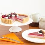 Cake stand with blackberry panna cotta tart.