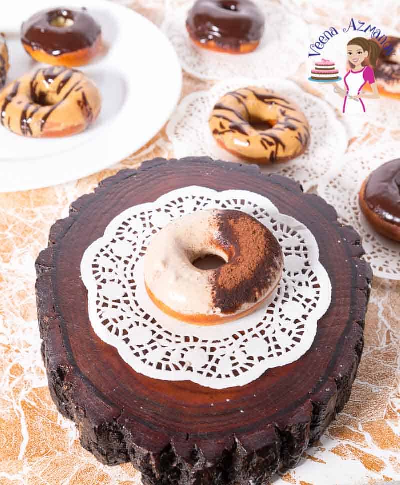 A doughnut with tiramisu glaze on a wooden stand.