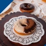 A donut on a wooden board