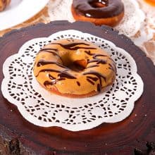 A plate with dulce de leche donuts.