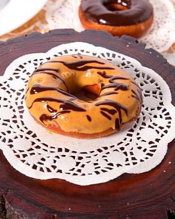 A plate with dulce de leche donuts.