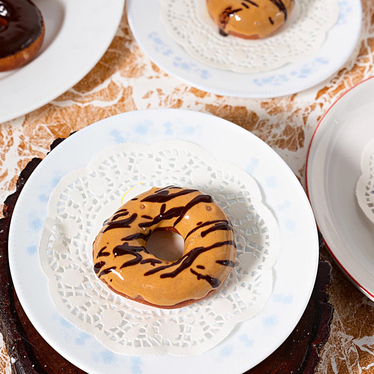 A plate with dulce de leche donuts.