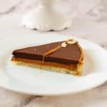 A slice of caramel tart on the plate.