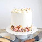 A birthday cake on the cake stand.